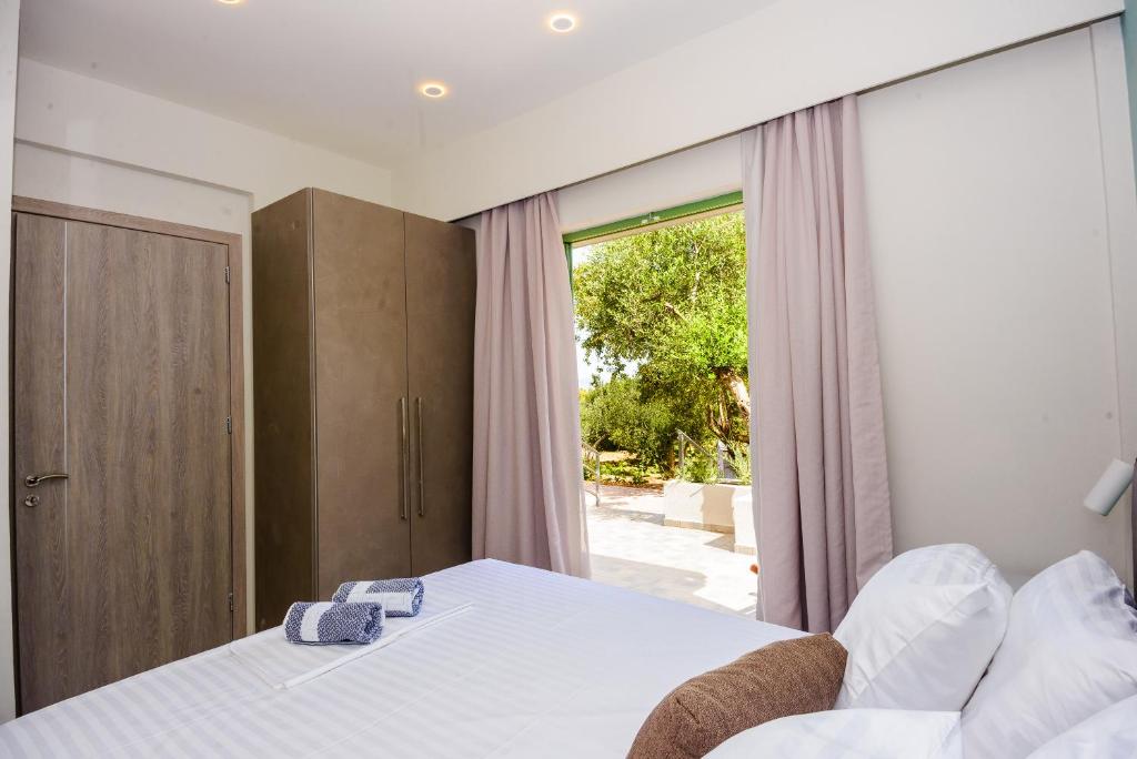 Postel nebo postele na pokoji v ubytování tzogias apartments pan