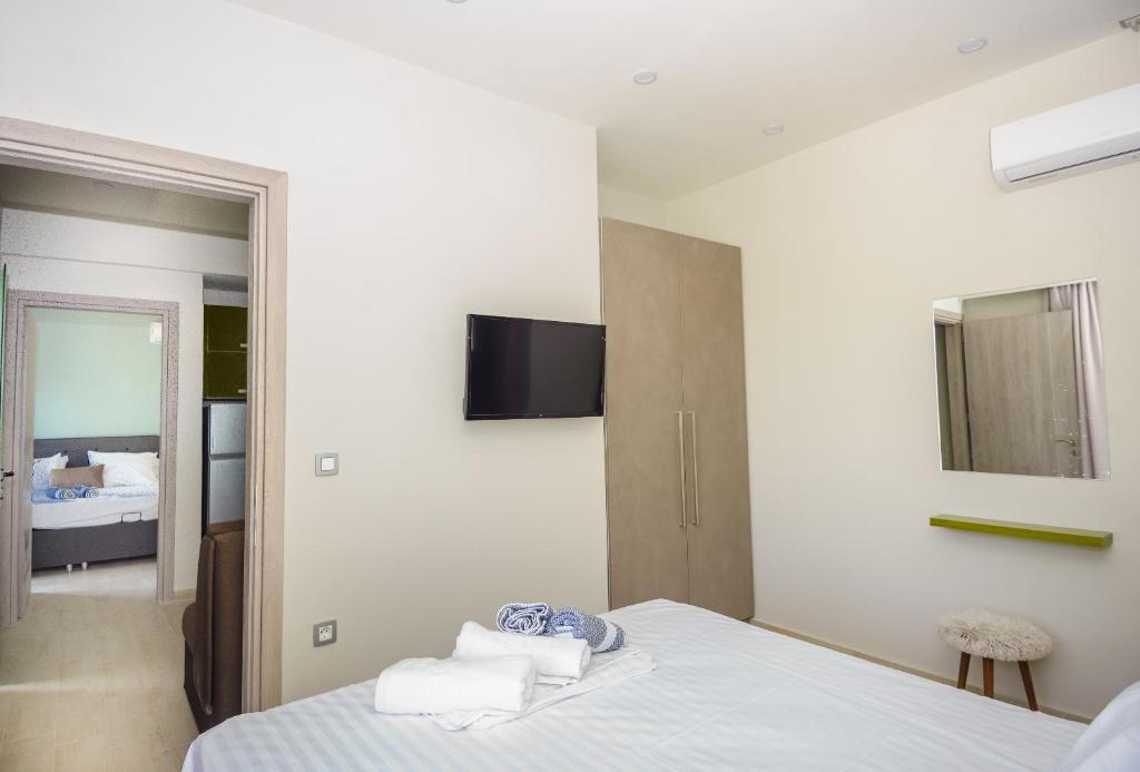 Postel nebo postele na pokoji v ubytování tzogias apartments pan