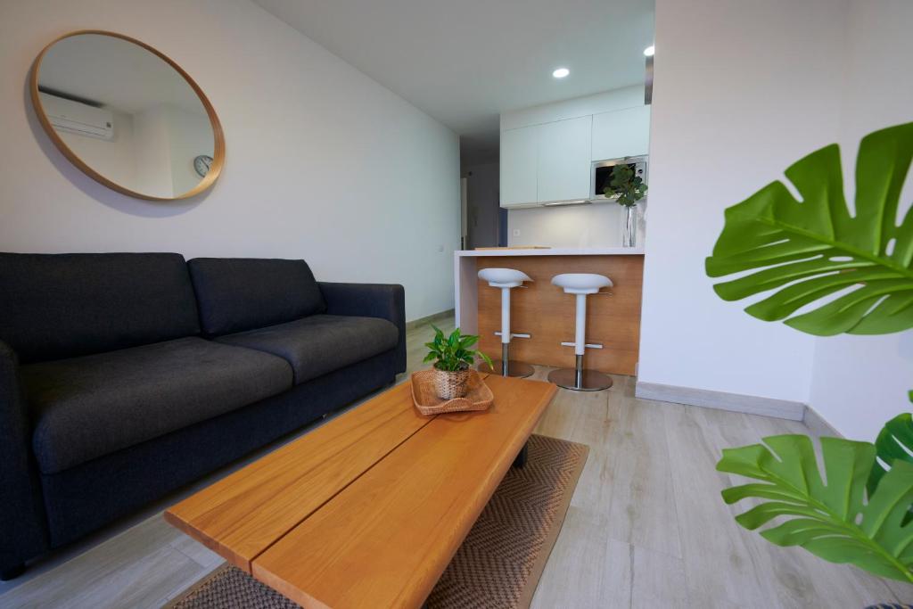 a living room with a couch and a table at ABLANCAS - La Restinga in La Restinga