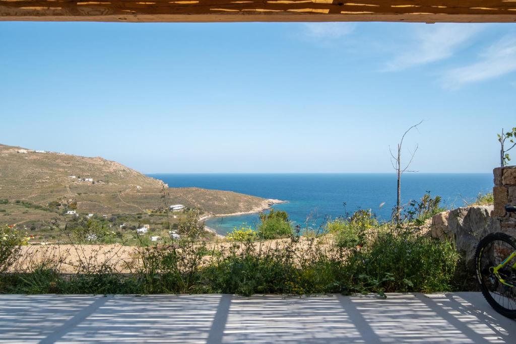 a view of the ocean from the porch of a house at Blue Sea Villa in Serifos Chora