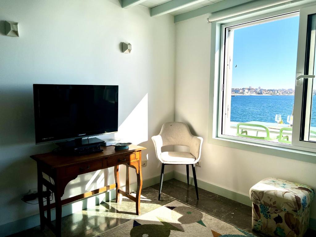TV a/nebo společenská místnost v ubytování Ocean dream apartment