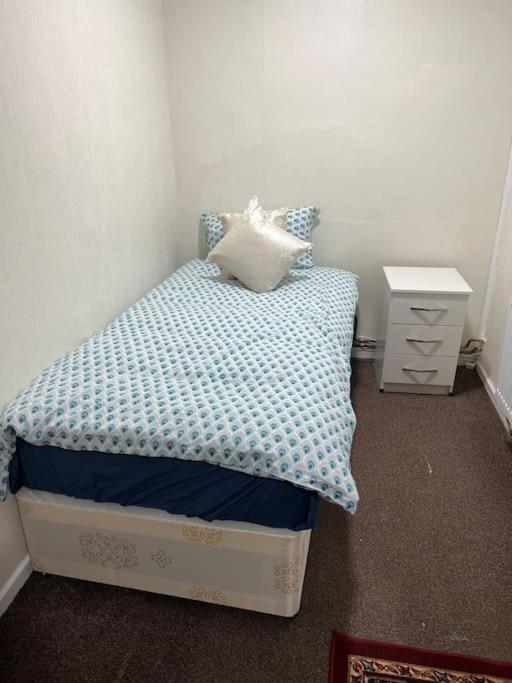 a small bedroom with a bed and a night stand at 016- 1 bedroom church street F31 in London