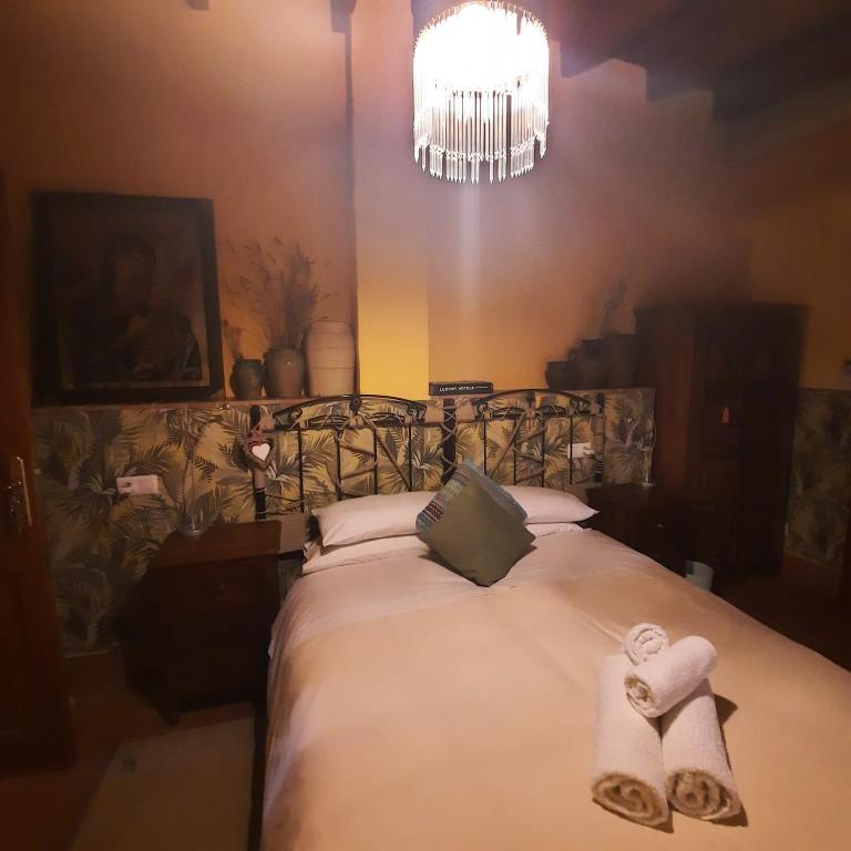 Postel nebo postele na pokoji v ubytování Casa Gallinera