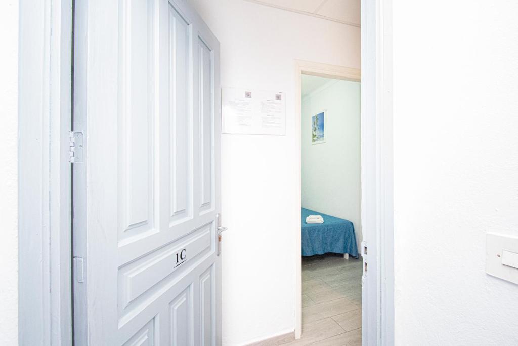 Posteľ alebo postele v izbe v ubytovaní Apartamentos Falcó