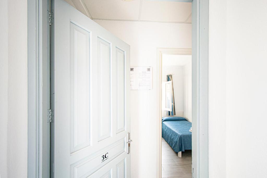Posteľ alebo postele v izbe v ubytovaní Apartamentos Falcó
