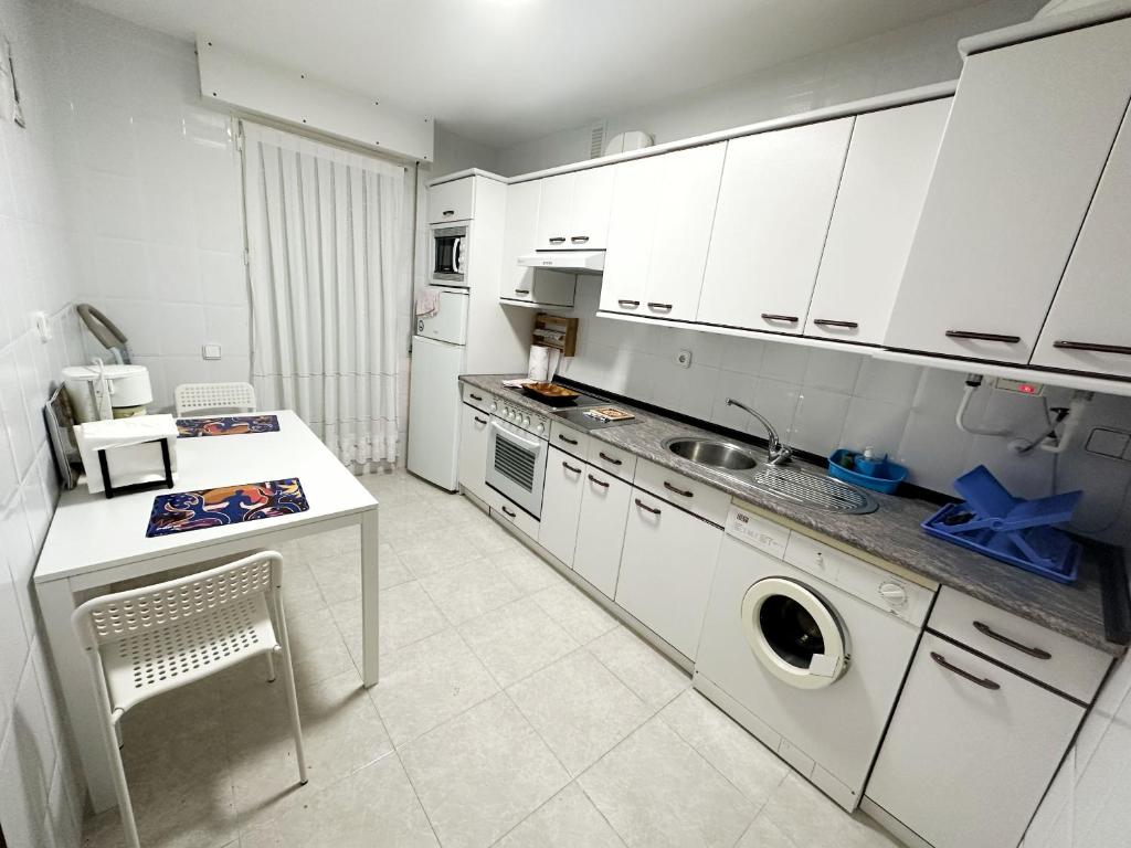 A kitchen or kitchenette at Cabo Quintres - 12012