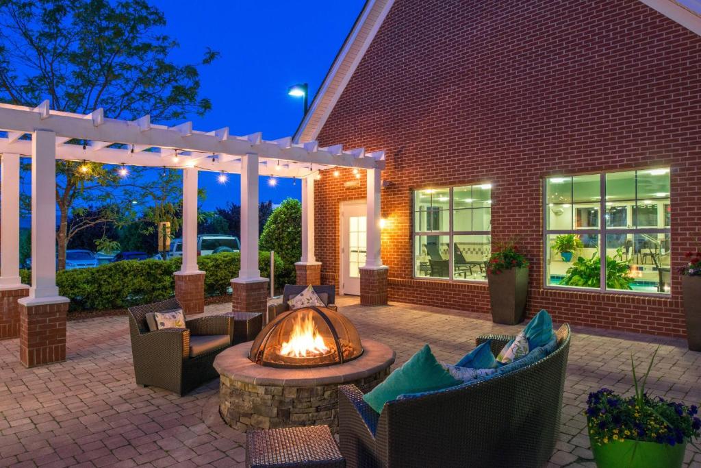 an outdoor patio with a fire pit and chairs at Residence Inn Waynesboro in Waynesboro