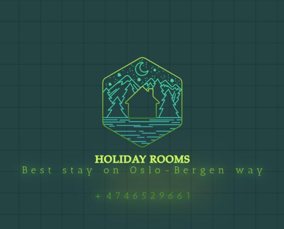 logotipo para una habitación de vacaciones con montaña en Holiday Rooms en Gol