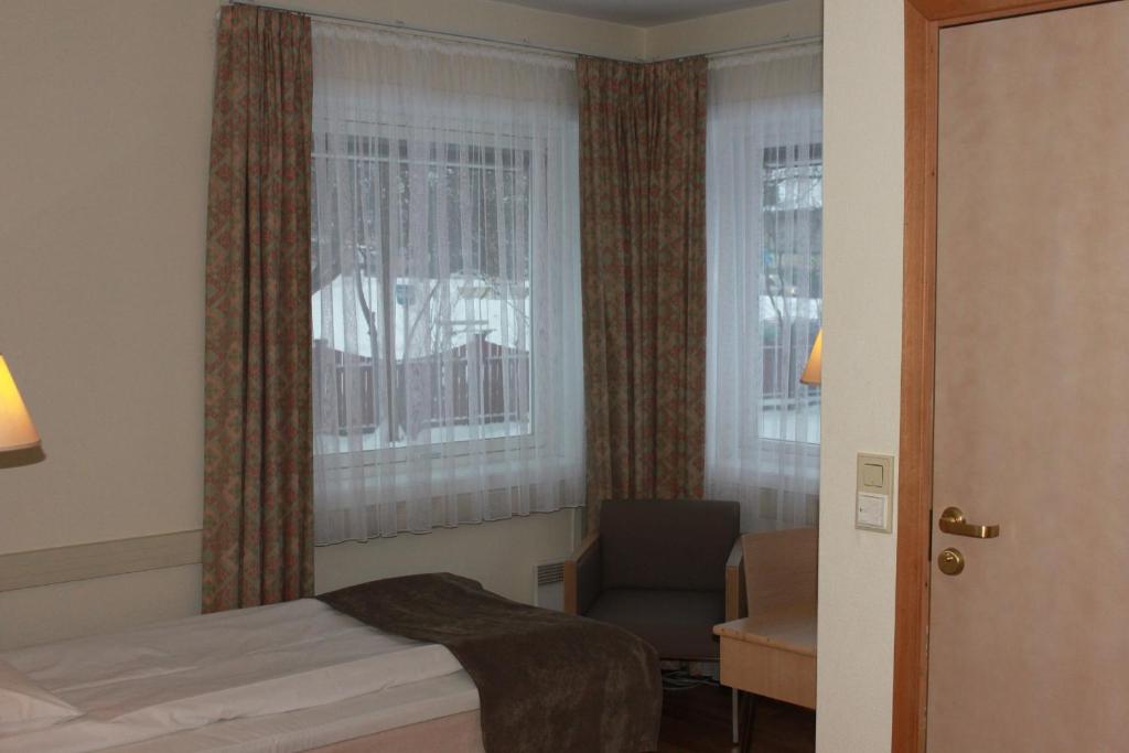 Postel nebo postele na pokoji v ubytování Mitt hotell & apartments