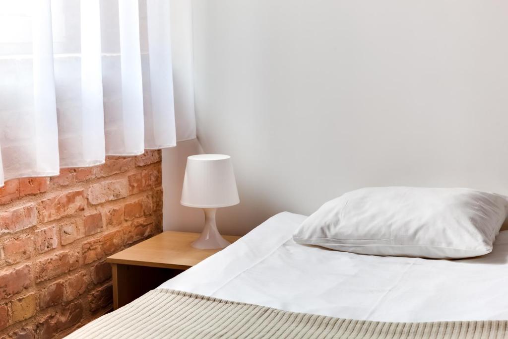 Postel nebo postele na pokoji v ubytování Janne Hotel