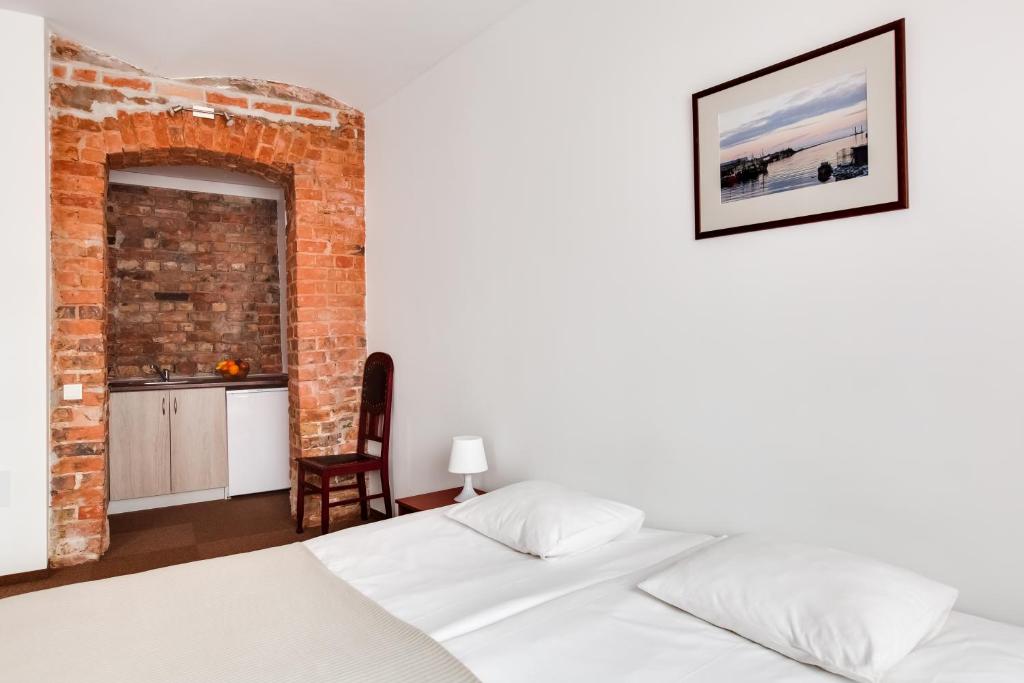 Postel nebo postele na pokoji v ubytování Janne Hotel