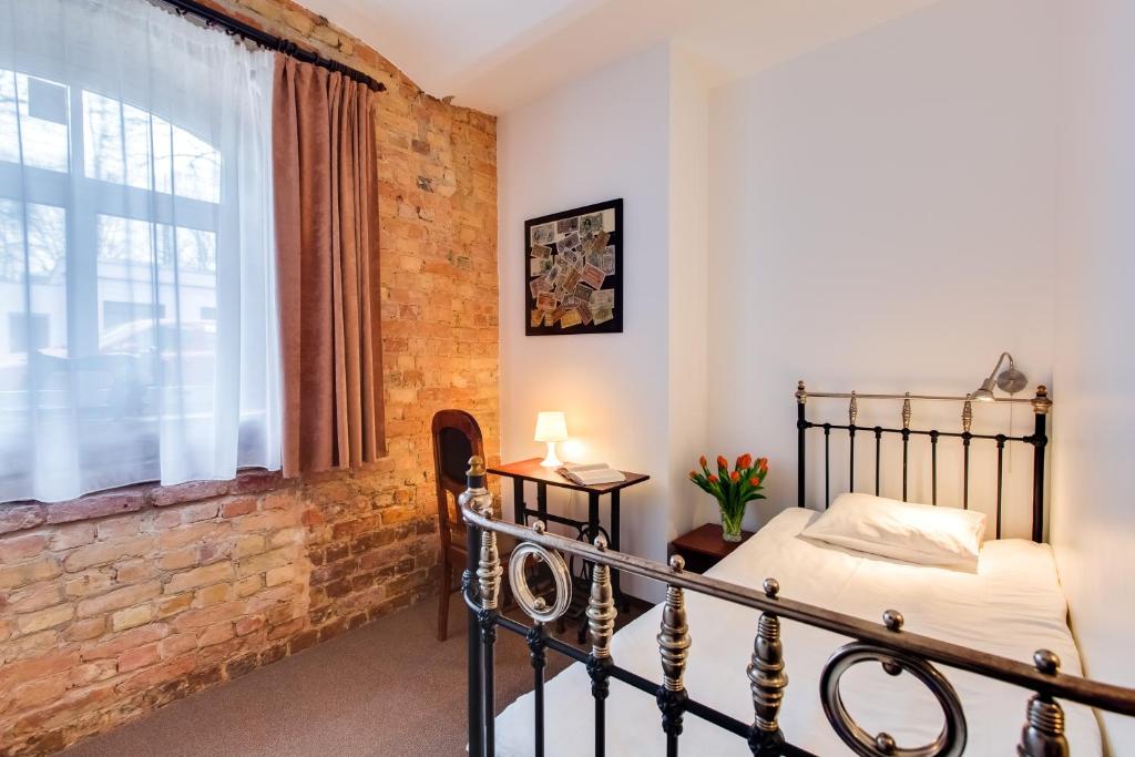 Postel nebo postele na pokoji v ubytování Janne Hotel