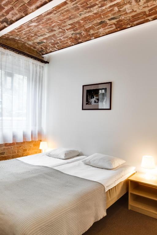 Postel nebo postele na pokoji v ubytování Janne Hotel