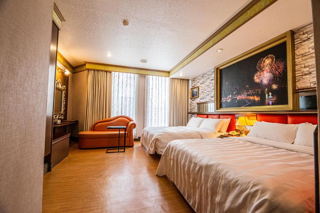 Postel nebo postele na pokoji v ubytování Wenpin Hotel - Pier 2