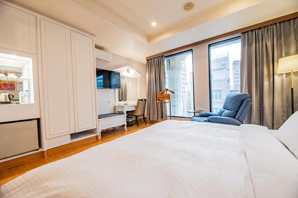Postel nebo postele na pokoji v ubytování Wenpin Hotel - Pier 2
