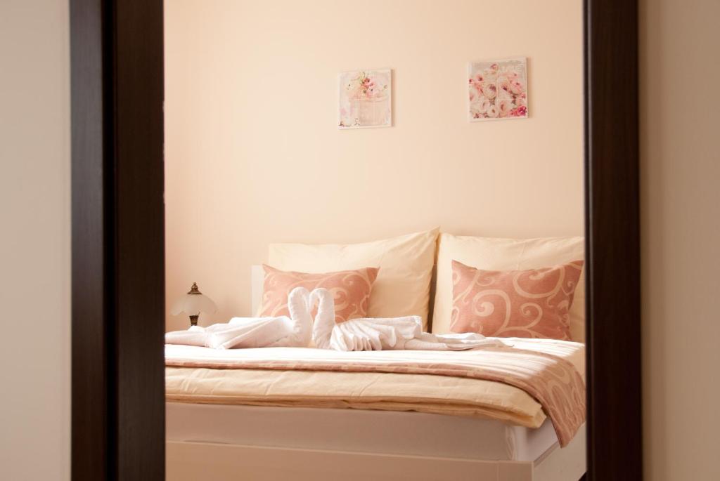 A bed or beds in a room at Apartmany Fonte