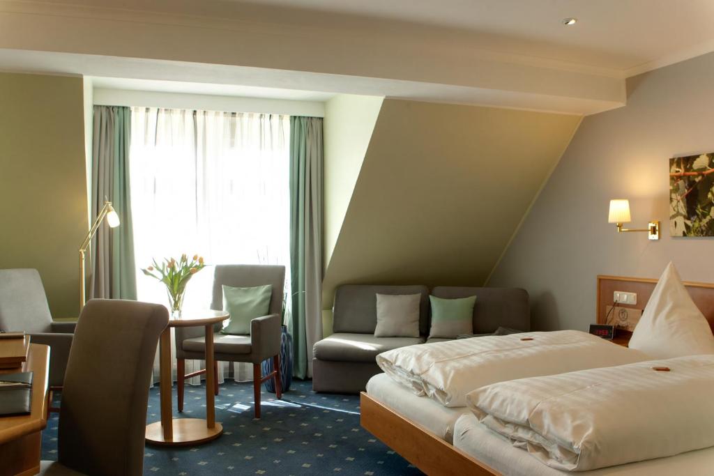 Postel nebo postele na pokoji v ubytování Landhotel Zur Bretzel