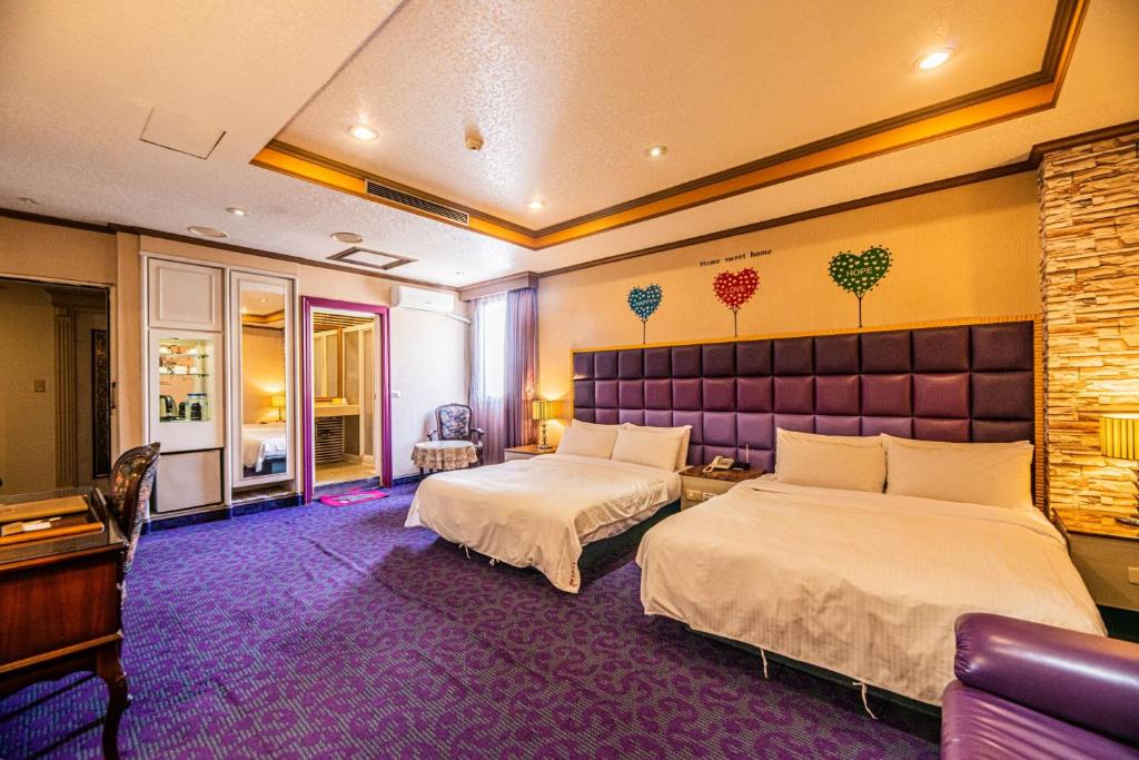 Postel nebo postele na pokoji v ubytování Wenpin Hotel - Pier 2