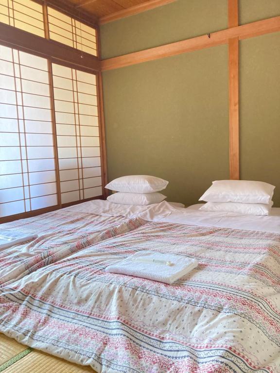 Postel nebo postele na pokoji v ubytování Guesthouse Namaste