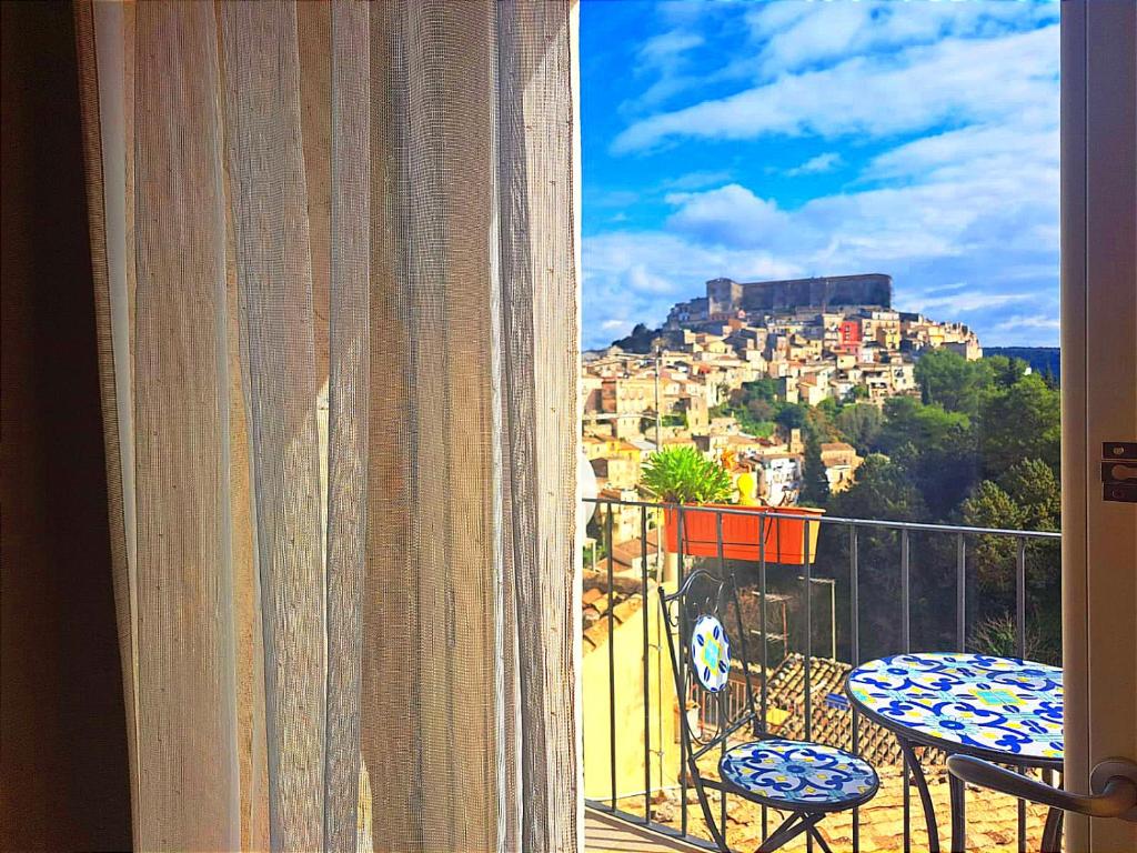 a view of a city from a balcony at B&B Cuore Barocco in Ragusa