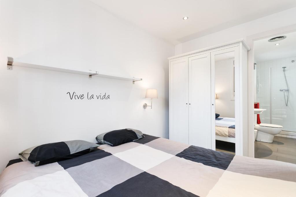 Posteľ alebo postele v izbe v ubytovaní Sant Pau Terraces Apartments