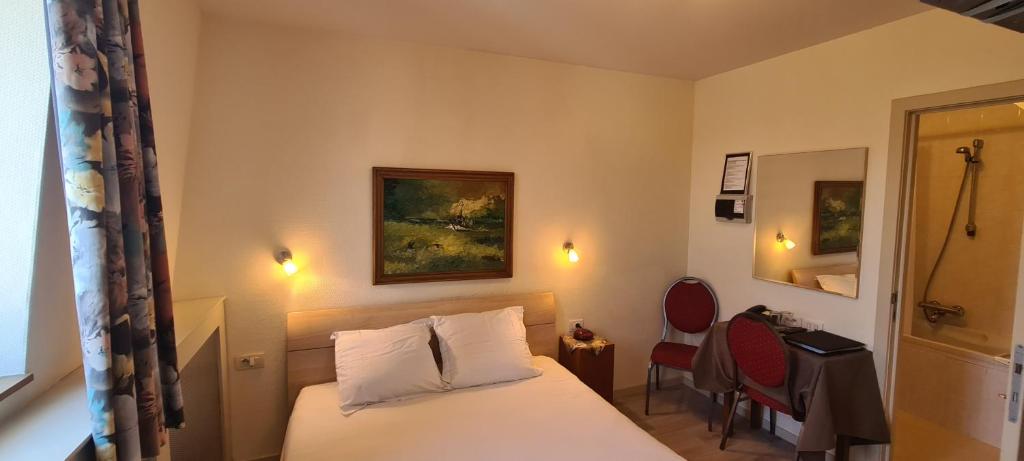 Postel nebo postele na pokoji v ubytování Alliance Hotel Ieper Centrum
