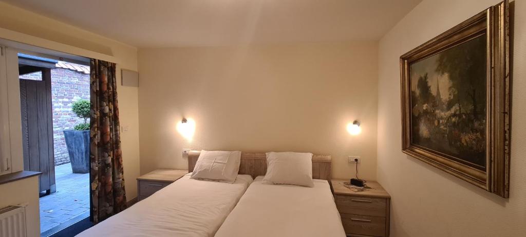 Postel nebo postele na pokoji v ubytování Alliance Hotel Ieper Centrum