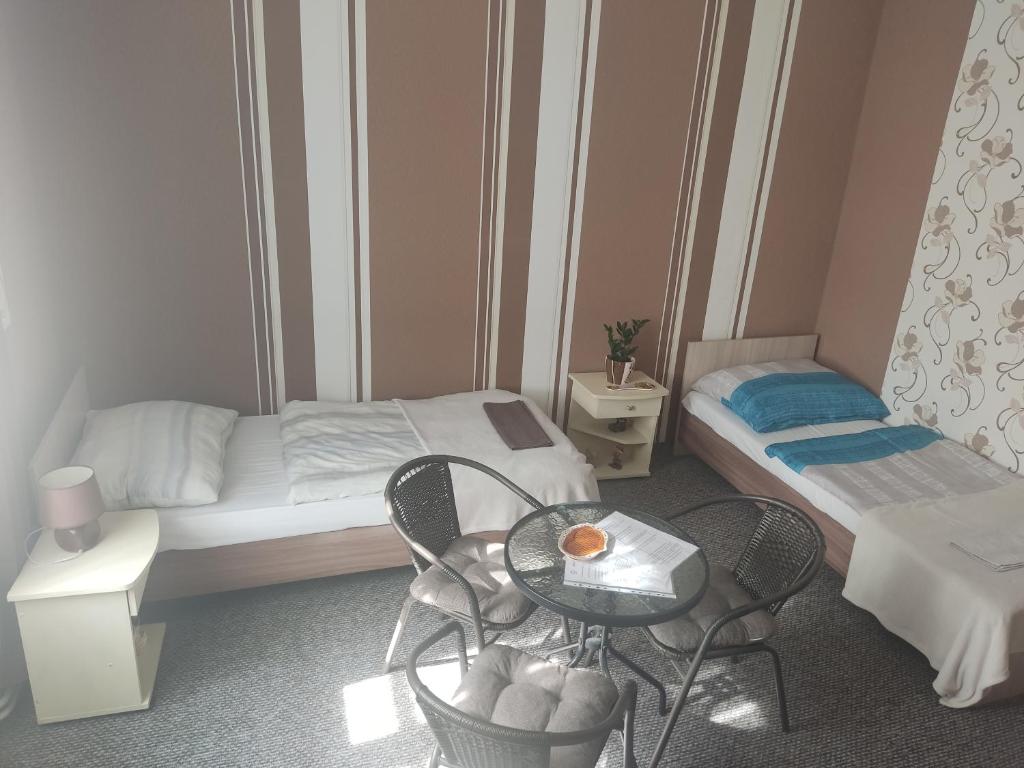Postel nebo postele na pokoji v ubytování Penzion U Soudu
