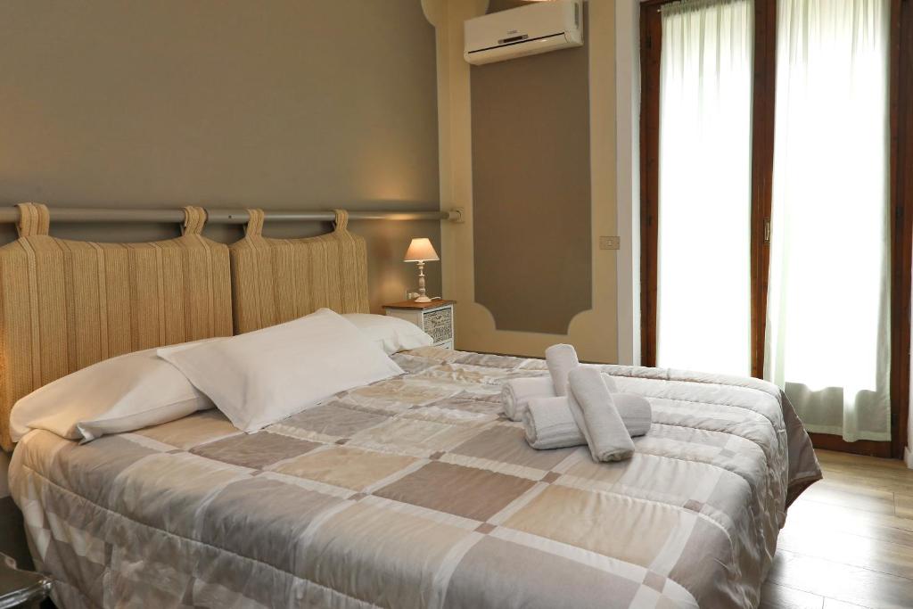 Postel nebo postele na pokoji v ubytování Hotel Andreis