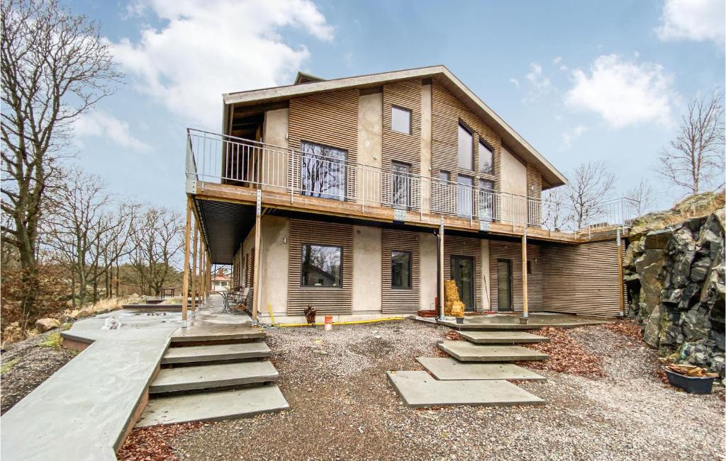 a house under construction with stairs leading up to it at Cozy Home In Vallda With Kitchen in Vallda