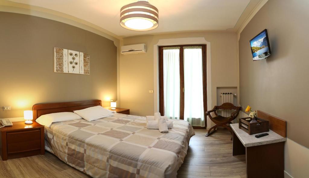 Postel nebo postele na pokoji v ubytování Hotel Andreis