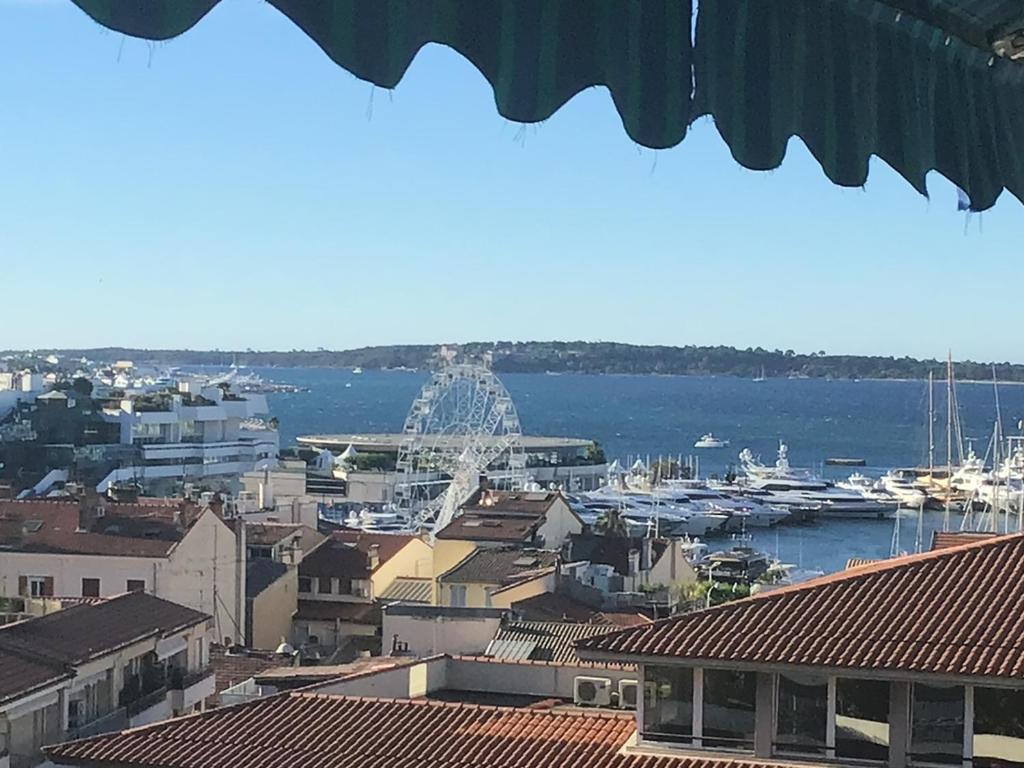 a view of a harbor with boats in the water at Cannes President, vue mer, festival, quartier forville le Suquet in Cannes