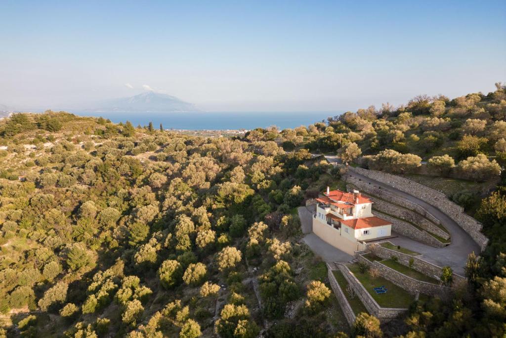 an aerial view of a house on a hill at Villa Vicky in Pythagoreio