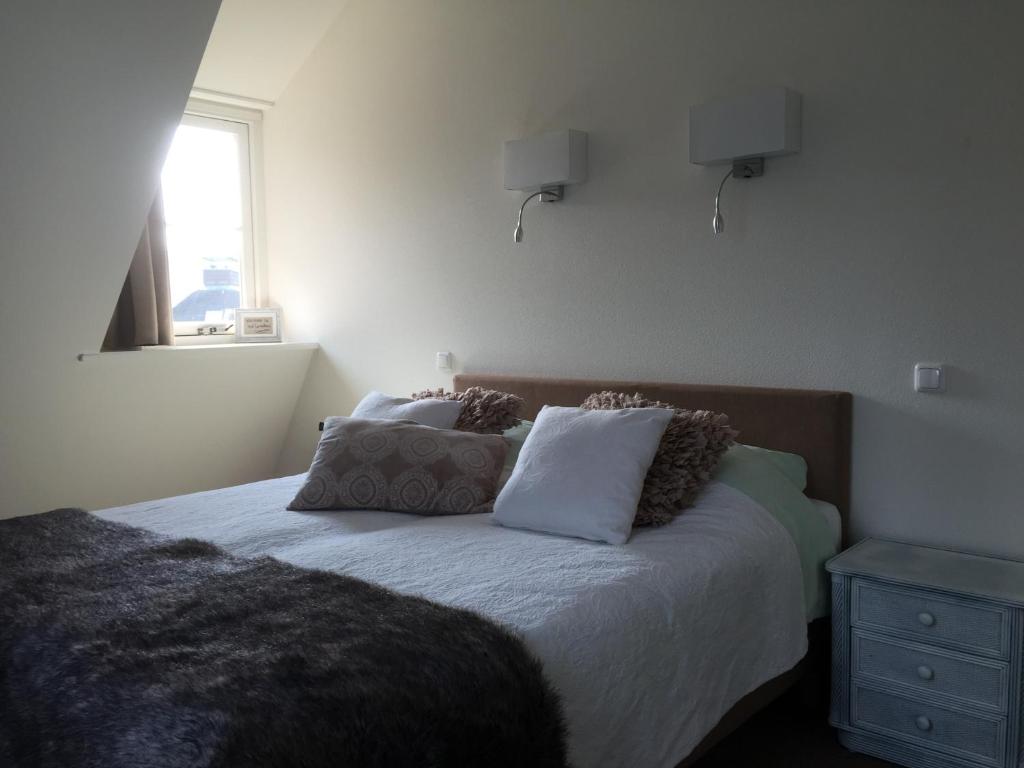 Postel nebo postele na pokoji v ubytování Herberg het Landhuis