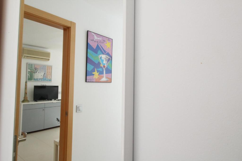 Televízia a/alebo spoločenská miestnosť v ubytovaní Del Parque Flats Pina Beach