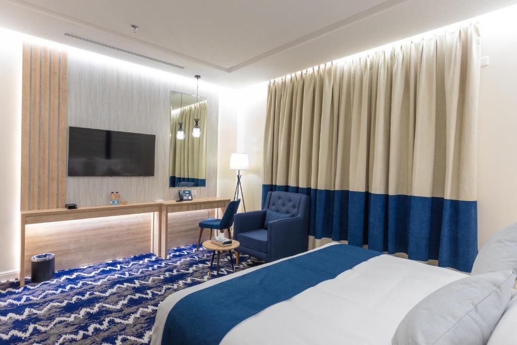 Postel nebo postele na pokoji v ubytování Le Reve Hotel إحدى فنادق مجموعة لوريف