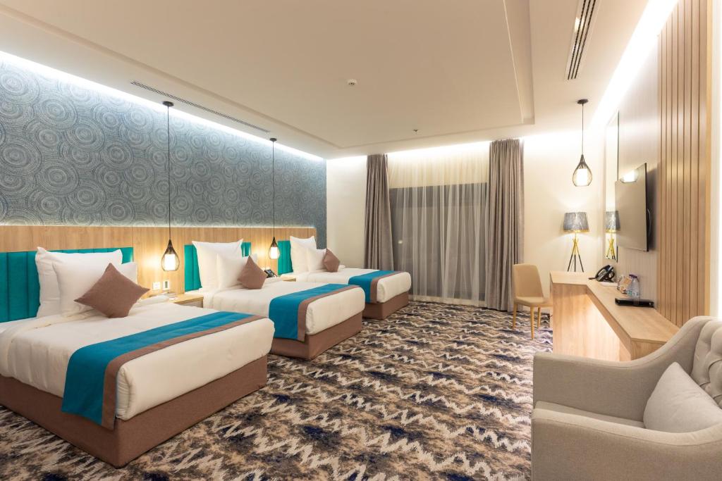 Postel nebo postele na pokoji v ubytování Le Reve Hotel إحدى فنادق مجموعة لوريف