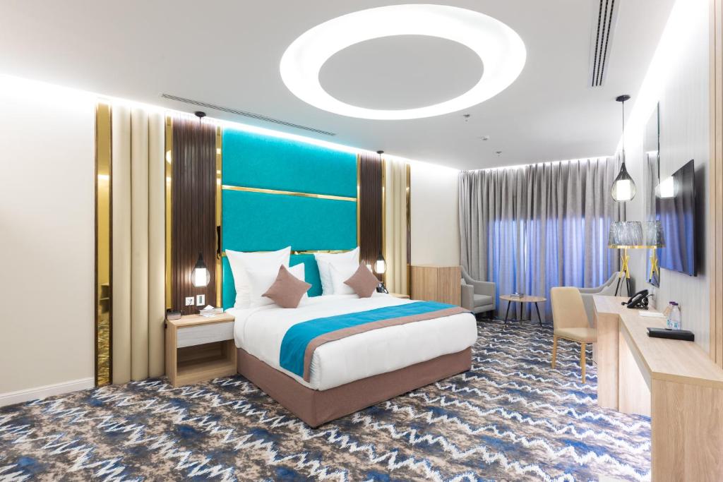 Postel nebo postele na pokoji v ubytování Le Reve Hotel إحدى فنادق مجموعة لوريف