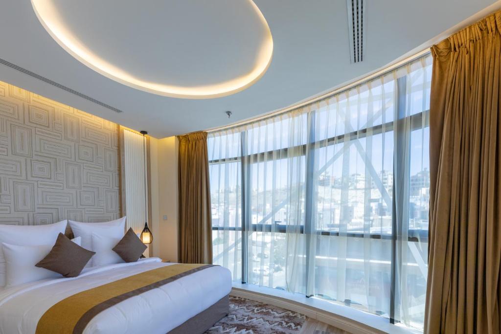Postel nebo postele na pokoji v ubytování Le Reve Hotel إحدى فنادق مجموعة لوريف