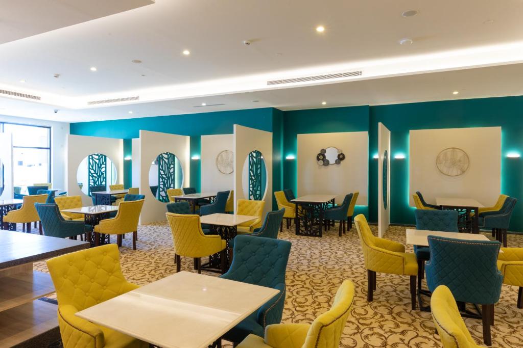 Posezení v ubytování Le Reve Hotel إحدى فنادق مجموعة لوريف