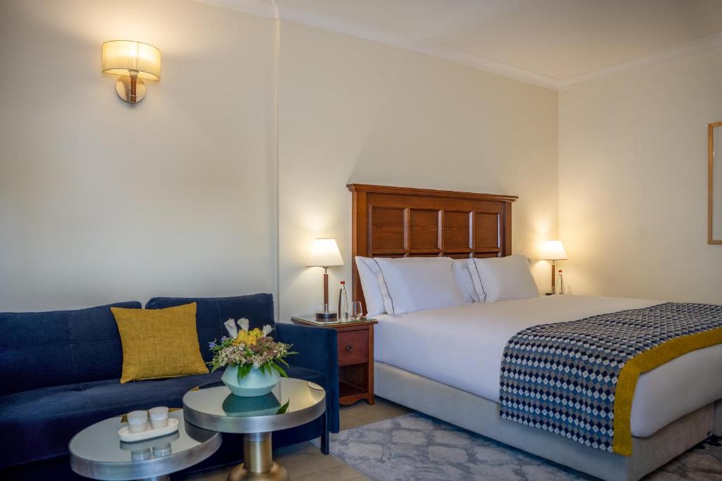 Postel nebo postele na pokoji v ubytování Ruth Safed By Dan Hotels
