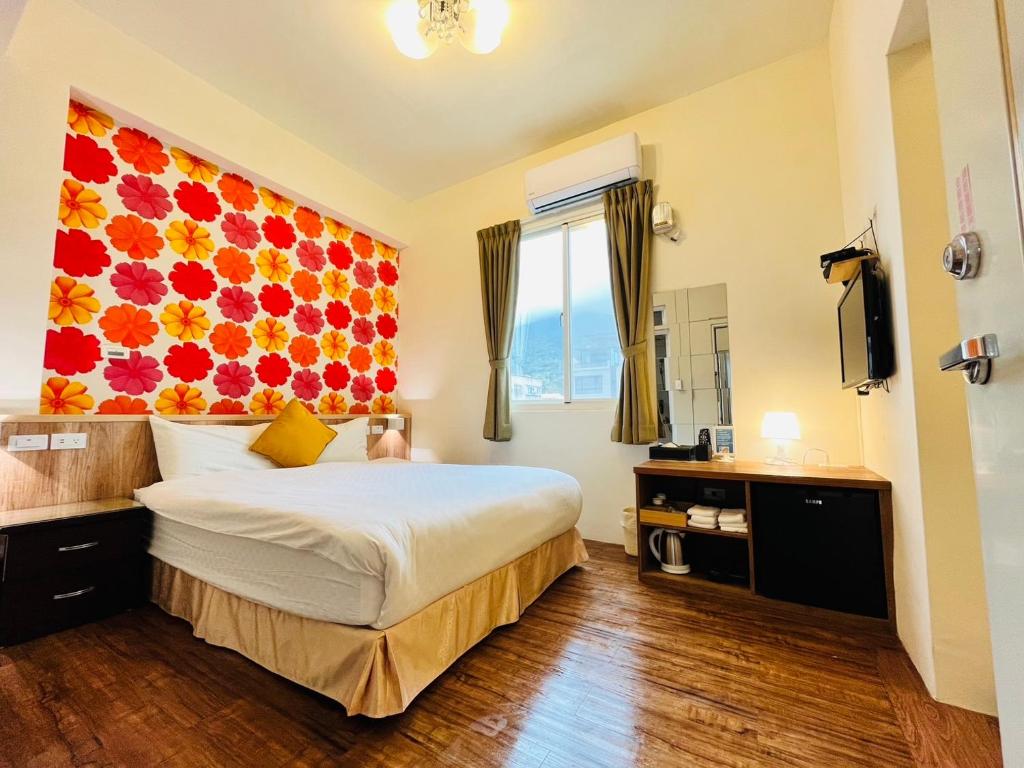 Postel nebo postele na pokoji v ubytování Sweet B&B 幸福微甜民宿