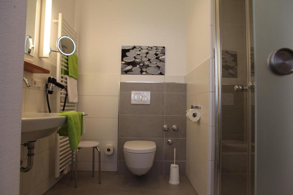 Koupelna v ubytování Hotel Alexa