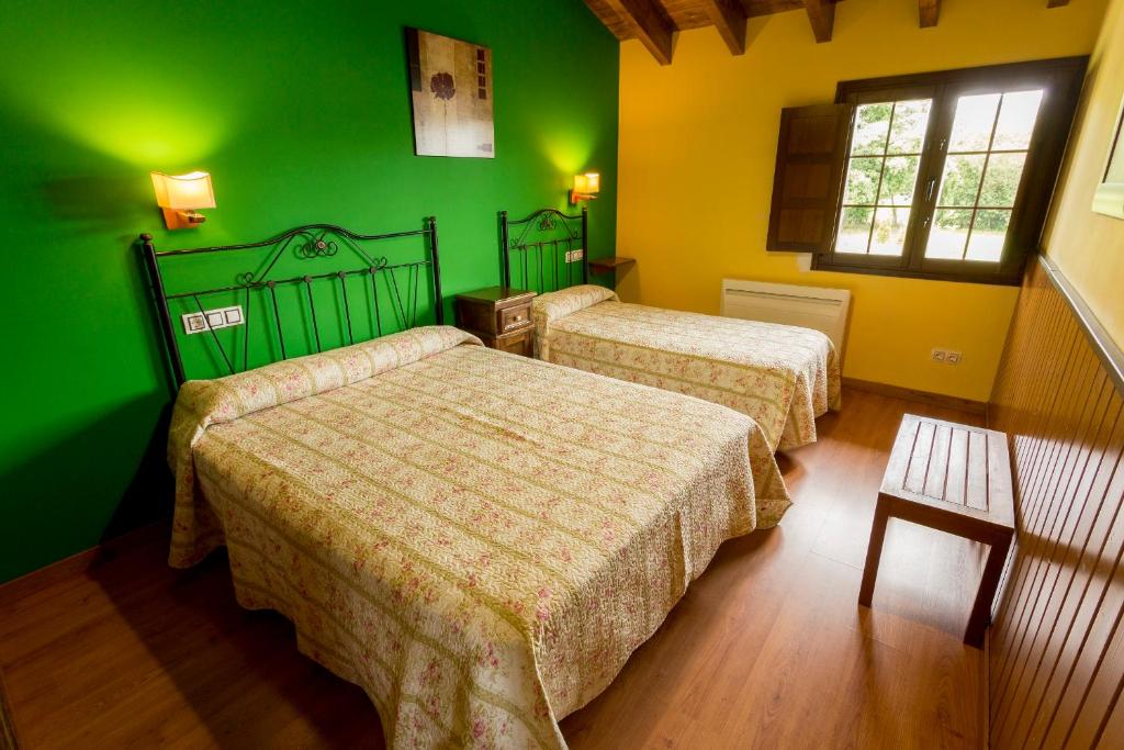 Postel nebo postele na pokoji v ubytování Apartamentos Rurales Villa del Sain Cudillero
