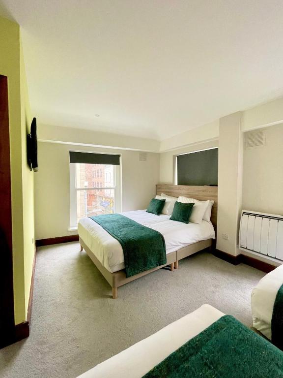 Cama ou camas em um quarto em The Norseman Temple Bar