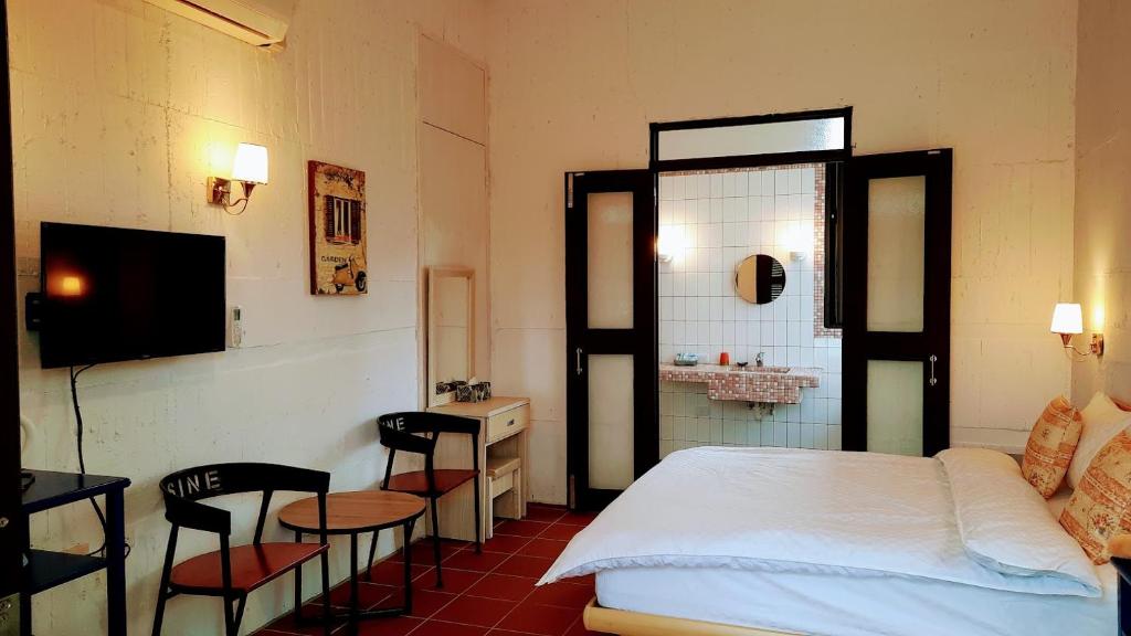 Postel nebo postele na pokoji v ubytování Kelly Field Homestay