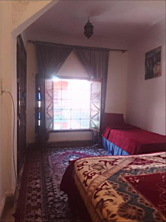 Postel nebo postele na pokoji v ubytování Riad Dar Zaida