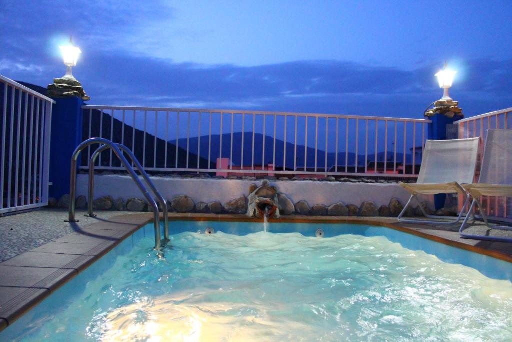a swimming pool on the roof of a house at Casa Aurora in Carcabuey