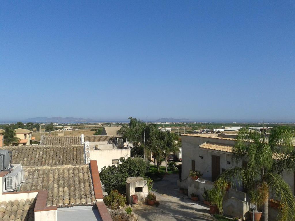 an aerial view of a city with buildings and palm trees at Rocca tagliata Marsala in Marsala