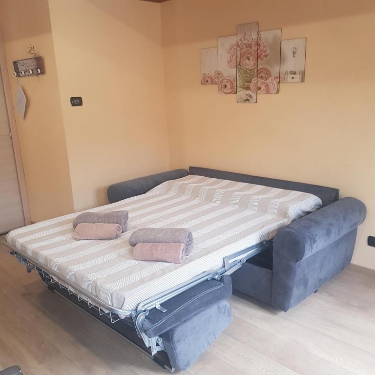 Łóżko lub łóżka w pokoju w obiekcie La Ca' d' Rina Casa Vacanze